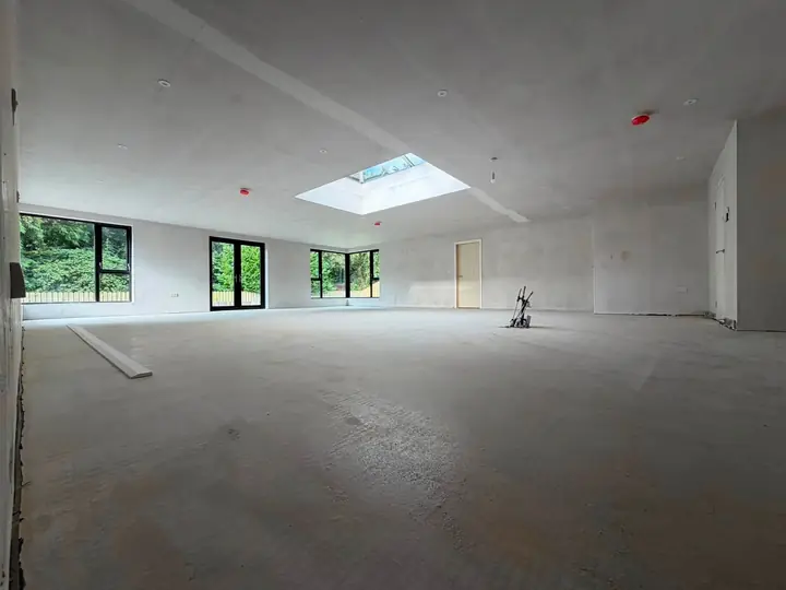The new room in the Drumahoe extension, with dark framed windows and a ceiling lantern