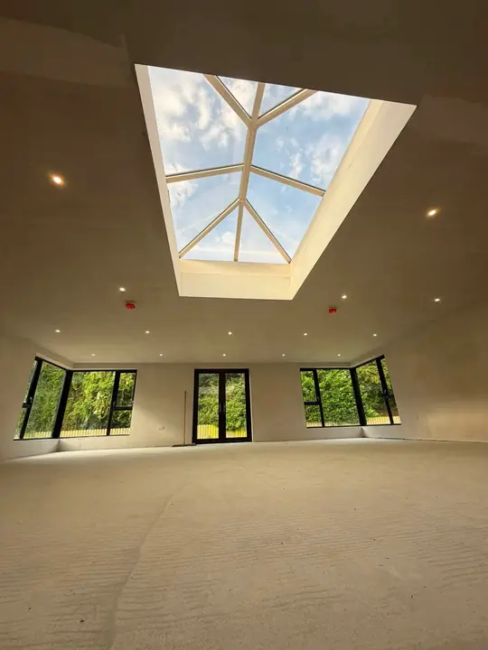 Looking up at a roof lantern in a newly plastered room